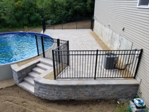 Raised stone patio and pool
