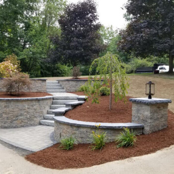 Landscaping multi-level stone walkway and stone block wall
