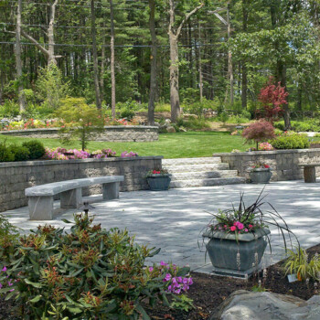 Step-down patio area surrounded by block retaining walls