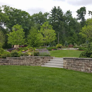 Two-level stone block retaining walls and stone steps